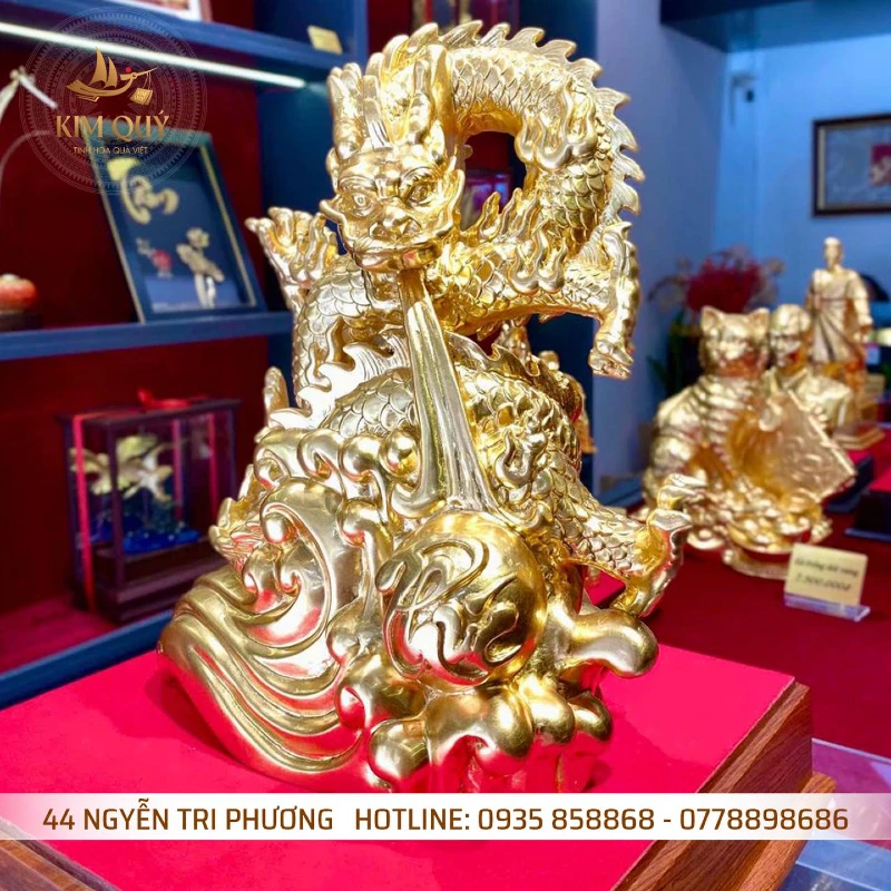 Tượng rồng rước phúc đón lộc dát vàng 9999